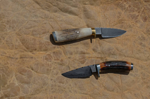 istock A pair of field dressing knives 675780056