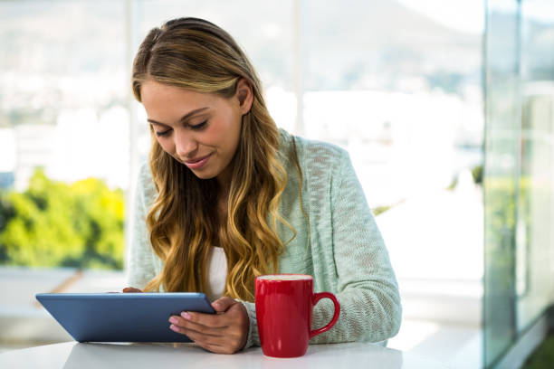 istock Girl with her tablet smiling 675780284