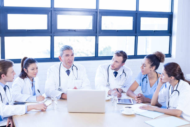 istock Medical team discussing in meeting 675780382