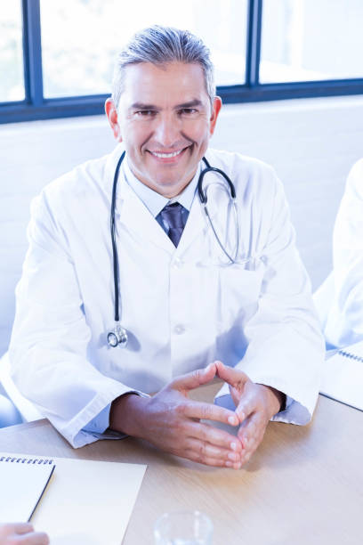 istock Doctor smiling in conference room 675780468