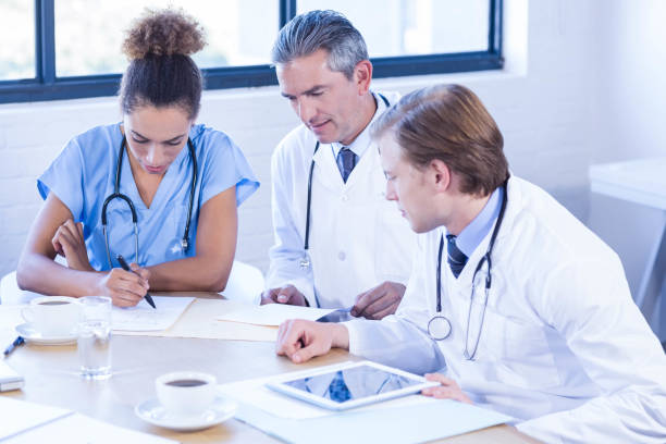 istock Medical team discussing in meeting 675782916