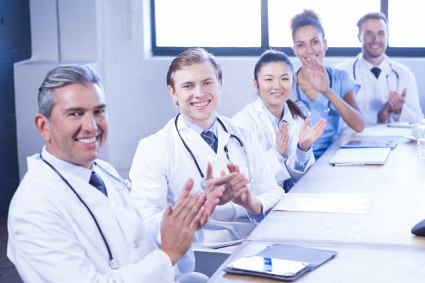 istock Medical team applauding in meeting 675782984