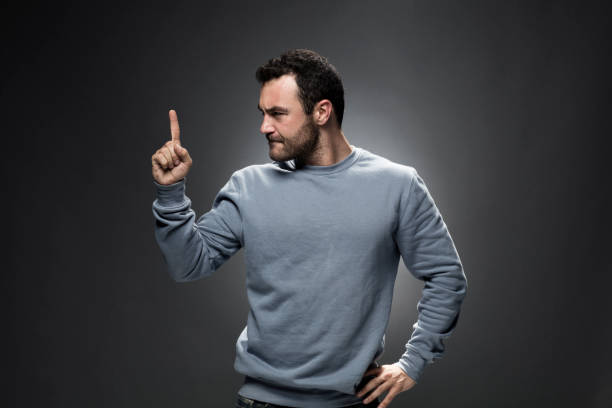 istock Young Man Showing Number One with Index Finger 675800458