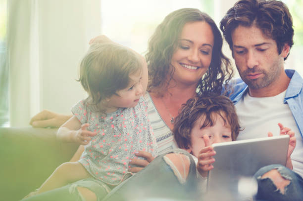 istock Father, Mother and children with digital tablet. 675801394