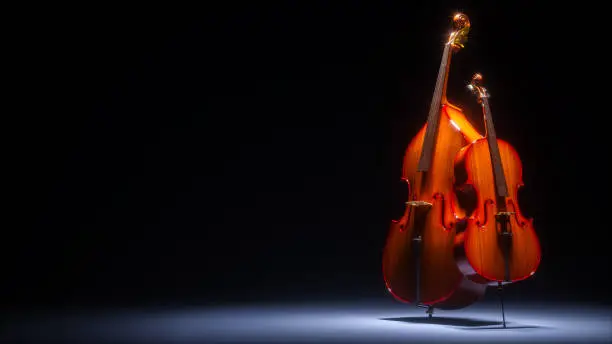 Photo of Double bass and cello in dark studio 3D rendering
