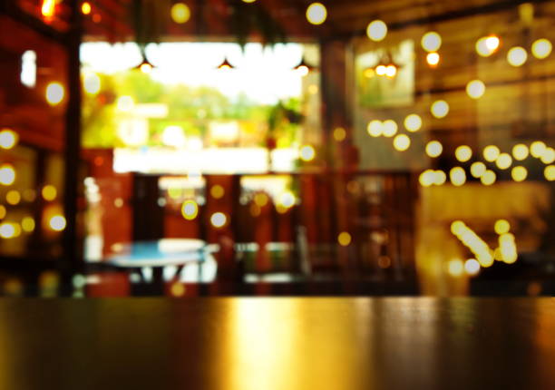 istock top of wood table with blur light bar at night 675804514