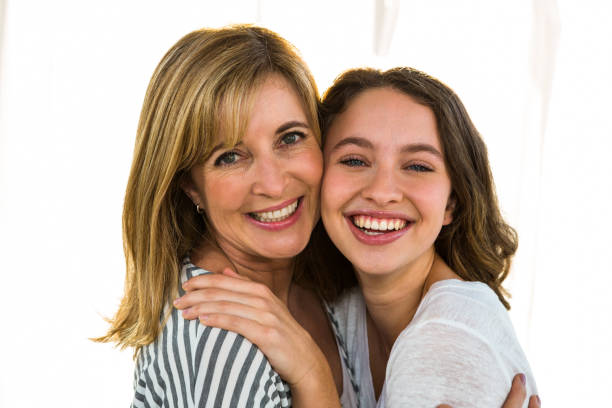 istock Mother and daughter hugging 675804788