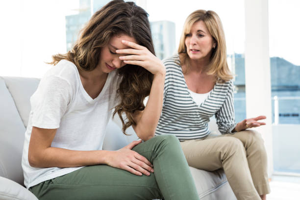 istock Sad daughter against mother 675805212