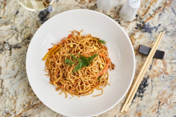 istock Flat noodles with pork slices 675810088