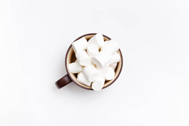 istock marshmallow in cup, top view flat lay on white background 675810676