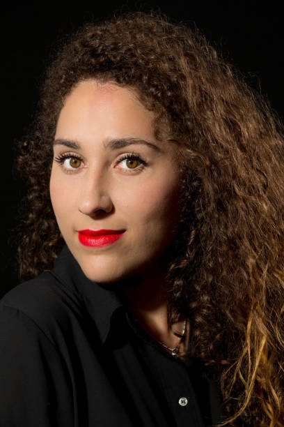 istock Curly Young Smiling Lady Portrait 675813816