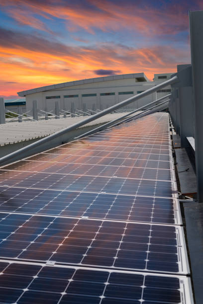 istock Sunset rays over a photovoltaic power plant 675814348