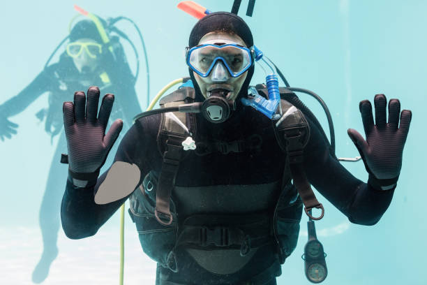 istock Couple practicing scuba diving together 675814850