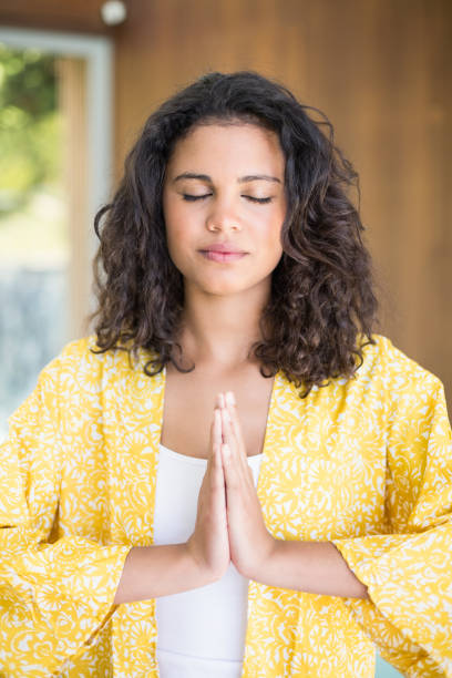 istock Young woman practicing yoga 675815094