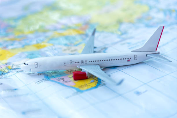 istock Model of a passenger aircraft on a map 675816714