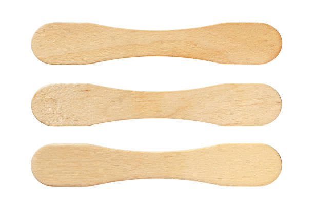 Ice cream sticks Ice cream sticks isolated on white background with clipping path popsicle stick stock pictures, royalty-free photos & images