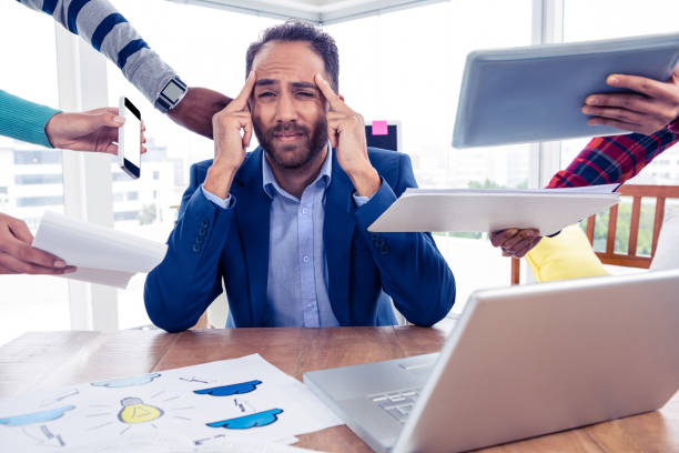 istock Stressful businessman by colleagues in creative office 675818860