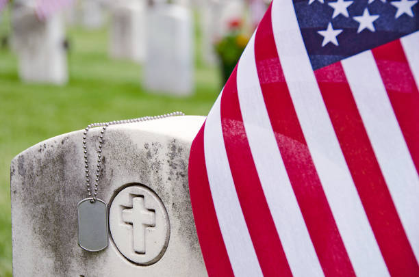 istock military dog tags and flag on tombstone 675819752