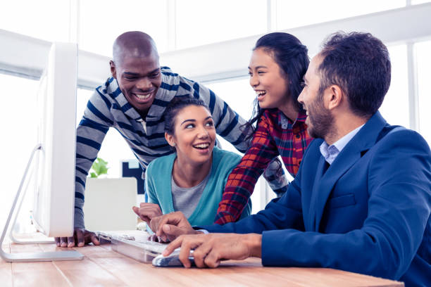 istock Happy business people discussing at creative office 675819778