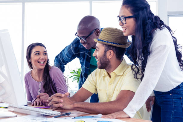 istock Business people laughing at desk 675820676