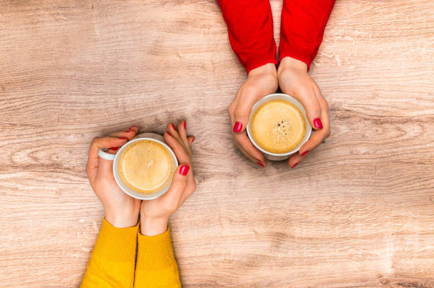 istock Female hands holding a cup of hot coffee 675820922