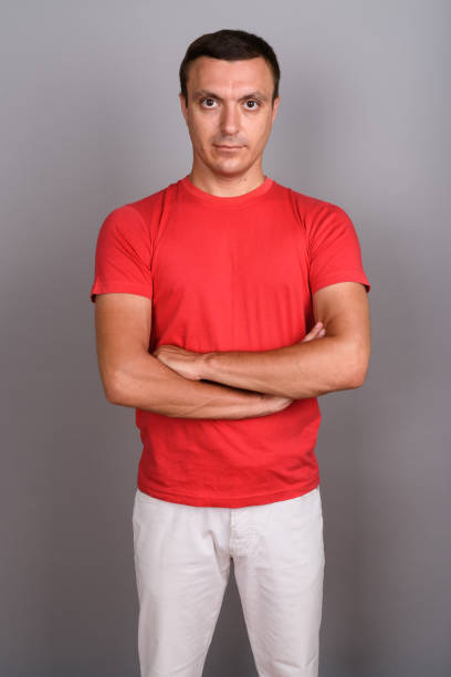 istock Studio shot of muscular handsome man against gray background 675821180