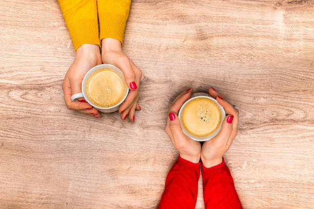istock Female hands holding a cup of hot coffee 675821202