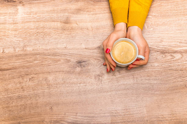 istock Female hands holding a cup of hot coffee 675821916