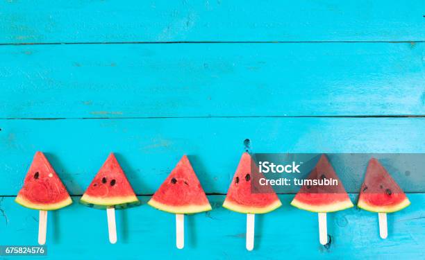 The Summer Watermelon Slice Popsicles On A Blue Rustic Wood Background Copy Space For Designer Stock Photo - Download Image Now