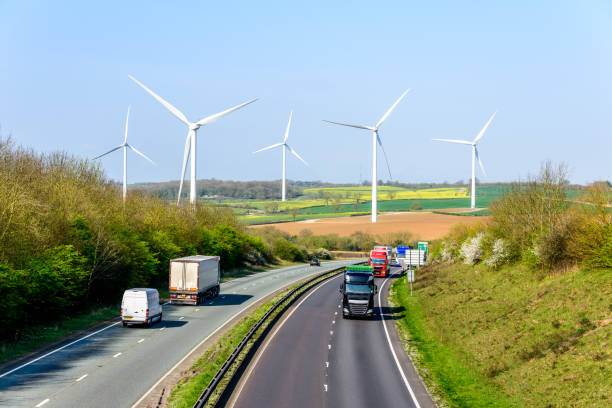 istock Day view UK Motorway Road Wind Turbines 675825682