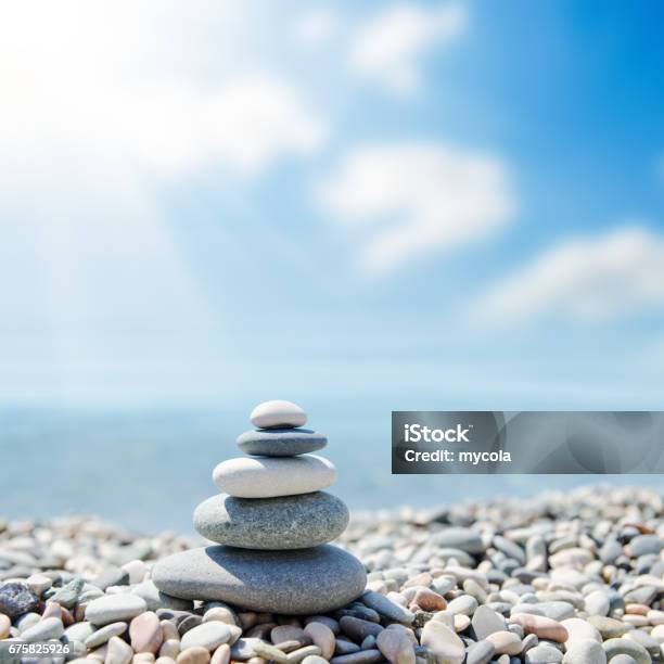 Zenlike Stones On Beach Under Sun Stock Photo - Download Image Now - Balance, Beach, Stone - Object