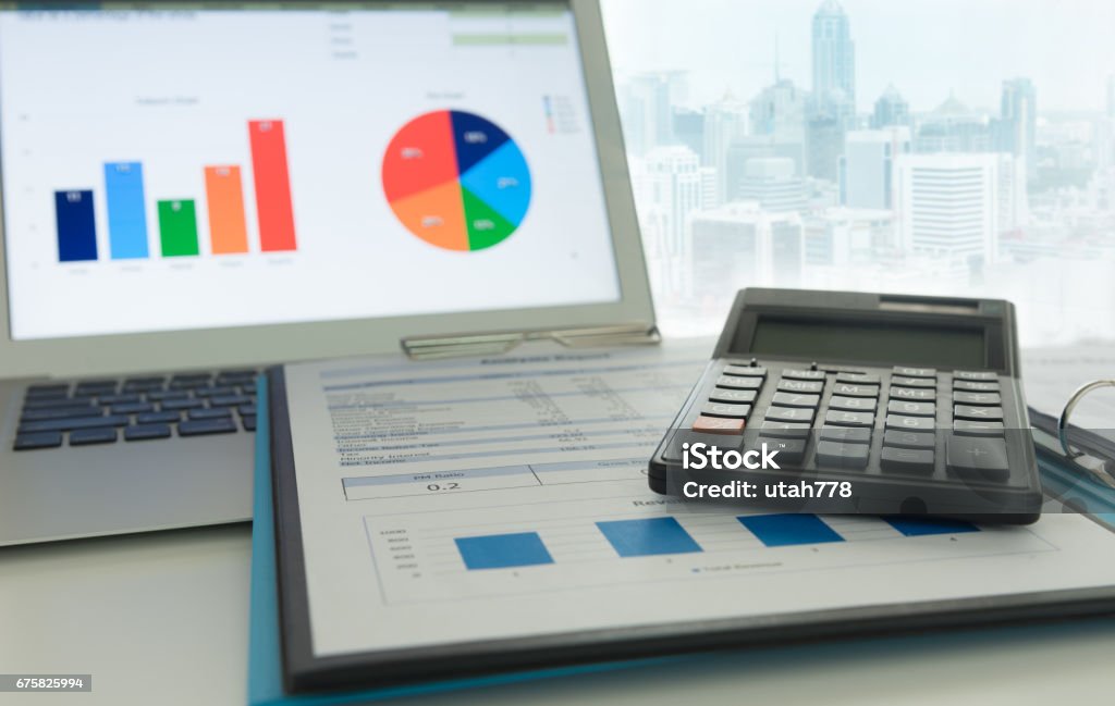 business financial accounting Financial planning accounting concept. Calculator on business and financial report on desk of entrepreneur. Portfolio Stock Photo
