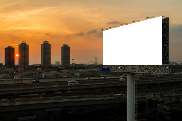 istock blank billboard beside express way at beautyful sunset used for advertising 675826608