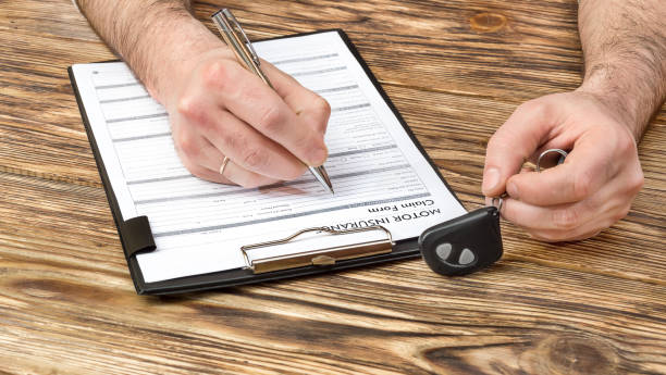 istock Man filling Car insurance form. 675827182