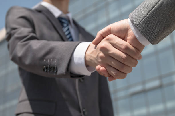 istock business people handshaking 675838846