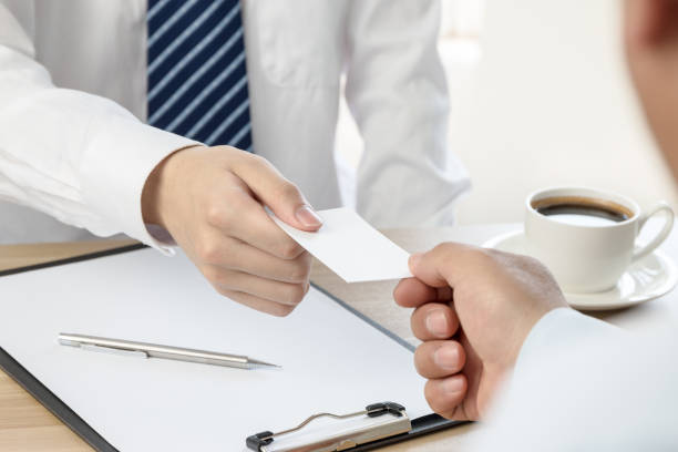 istock Businessman exchanging business cards 675895596