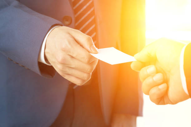 istock Businessman exchanging business cards 675895694