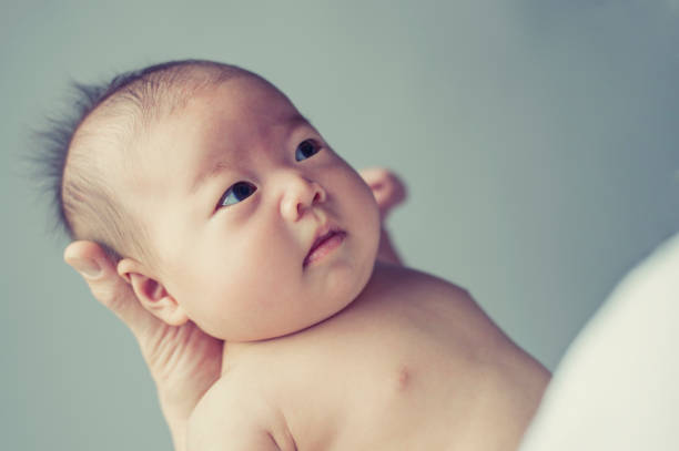 istock Baby girl with father in studio shot 675896502