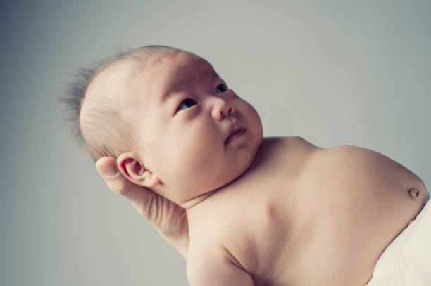 istock Baby girl with father in studio shot 675896530