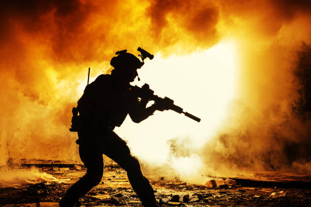 istock Black silhouette of soldiers 675897294