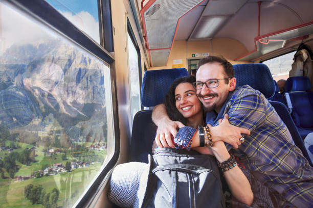 istock Couple traveling with train, embracing 675903474