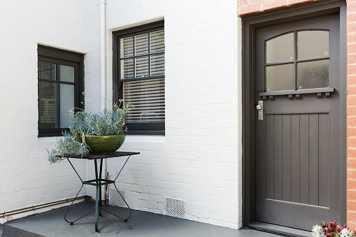 Entry porch and front door of an art deco style apartment in Australia