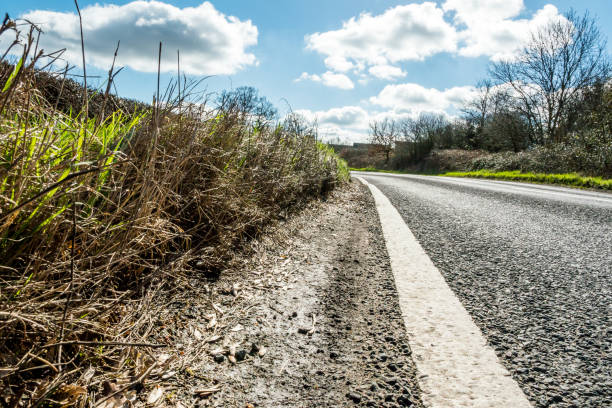 istock Sunny Day View of Empty UK Country Road 675909892