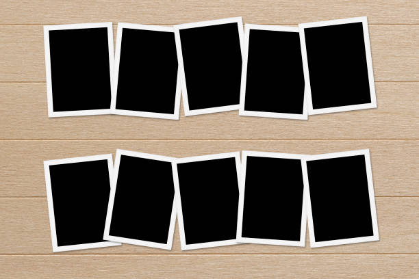 istock Blank photos on Wooden Table Background 675909990
