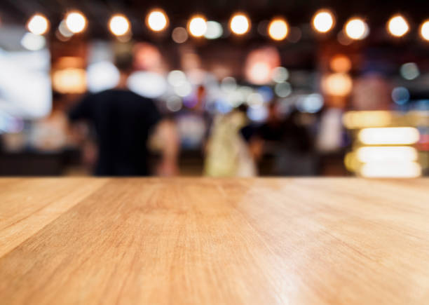 istock Table Top Counter blurred People Bar Restaurant Party event Background 675912872