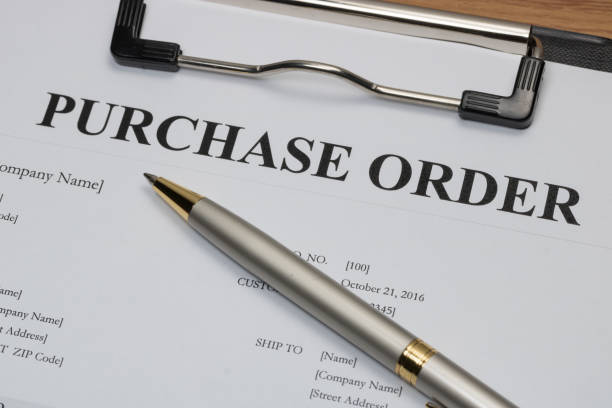 istock Close up of purchase order form with pen  / selective focus 675913422