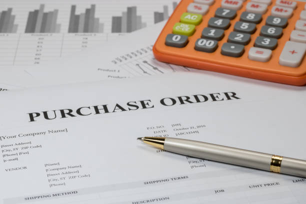 istock Purchase order form with pen and calculator 675913474