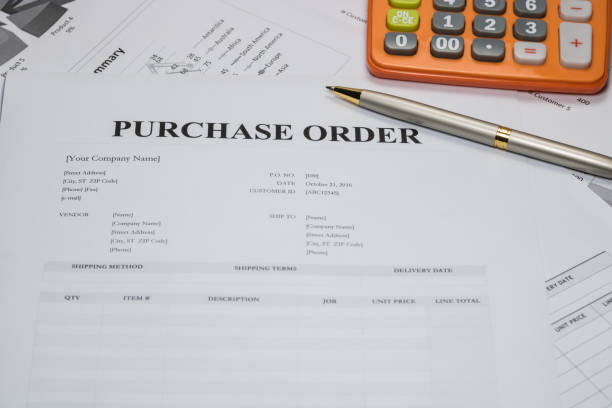 istock Purchase order form with pen and calculator 675913486