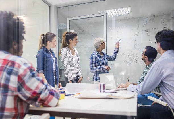istock Team of engineers brainstorming while having a meeting in the office. 675914010