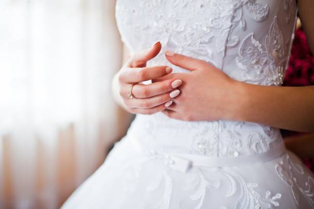 istock Hands of bride with married ring 675920834